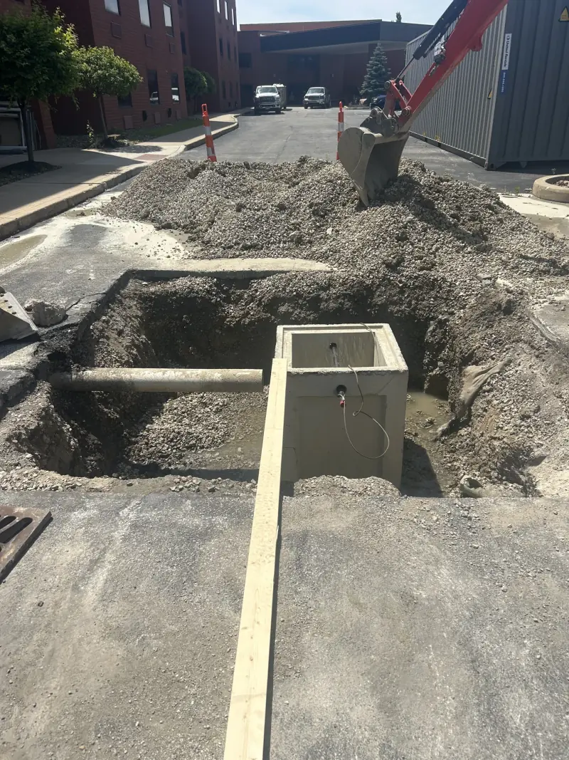 Drainage work underway beside a property